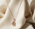 Rose Gold Butterfly Pendant Chain. A rose-gold chain with a crystal butterfly pendant.