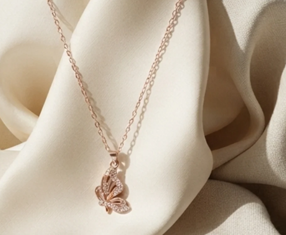 Rose Gold Butterfly Pendant Chain. A rose-gold chain with a crystal butterfly pendant.