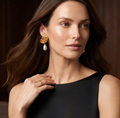 Gold Petal Pearl Drop Earrings. Sculpted gold petals with a single pearl drop, an elegant everyday statement.
