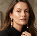 Gold Leaf Fringe Drop Earrings. A crystal bar stud with a cascade of shimmering gold leaf discs.