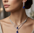 Sapphire Blue Double-Layer Necklace Set. Two crystal strands with sapphire-blue teardrop accents and matching earrings.