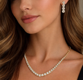 Gold Crystal Line Necklace. A graduated line of crystals on gold for an elegant neckline.