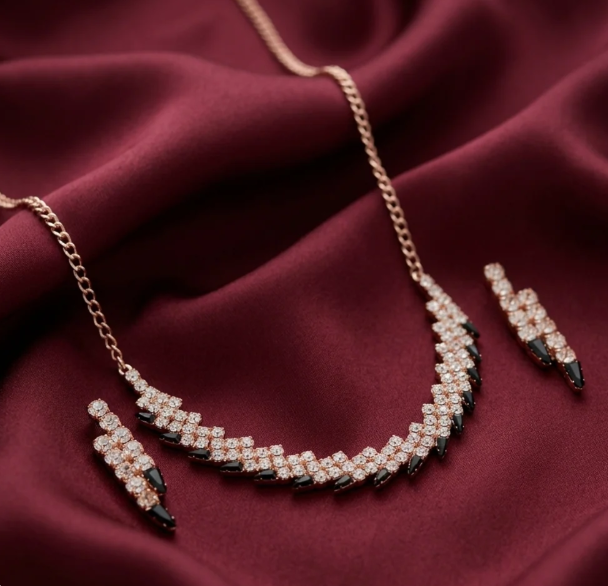Rose Gold Black & Crystal Necklace Set. Rose-gold chain with a band of crystal and black stones, with matching earrings.