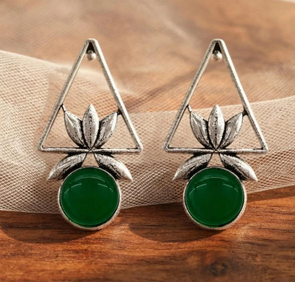 Triangle Lotus Drop Earrings in Emerald Green. Oxidised silver-finish earrings with an open triangle frame, sculpted lotus leaves and a round polished stone drop.